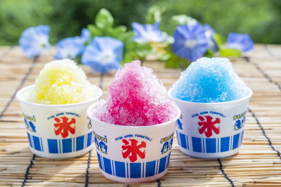 Colorful kakigori shaved ice desserts served in glass bowls